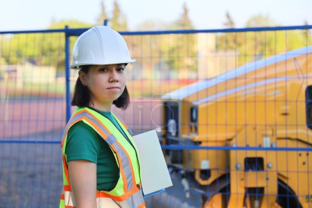 Photo for Outdoor builder woman portrait, construction woman worker on a workplace - Royalty Free Image