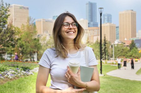 Photo for Happy student woman portrait in a big city - Royalty Free Image