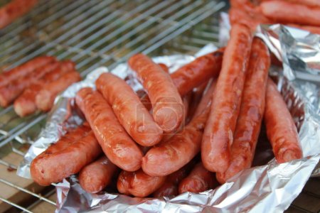 Grilled Sausages. Grilled sausages on aluminum foil