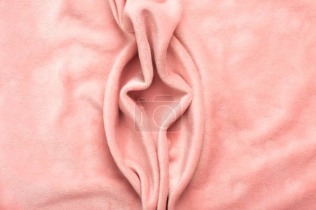 Photo for Pink soft fabric shaped as female genital organs, vulva and labia, vagina concept. High quality photo - Royalty Free Image