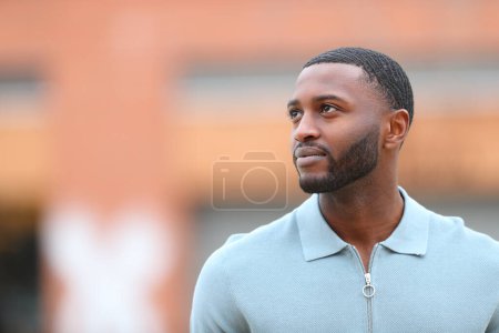 Photo for Black man looking at side in the street with copy space - Royalty Free Image
