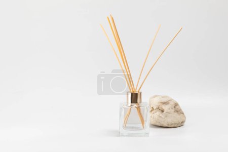 Aroma diffuser and sea stone on a gray background. Place for text