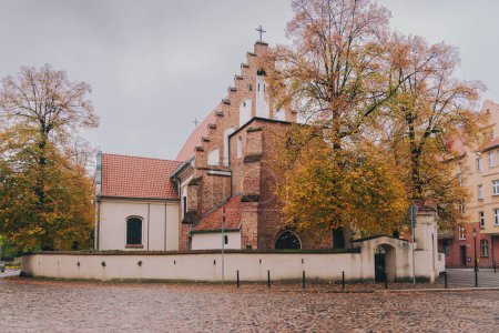 Photo for Brick Church of St. Margaritas in Poznan. The old parish church of the Srodka district - Royalty Free Image