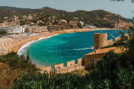 Photo for City walls of Tossa de Mar with the main beach Platja Gran in the background. Villa Vella. - Royalty Free Image
