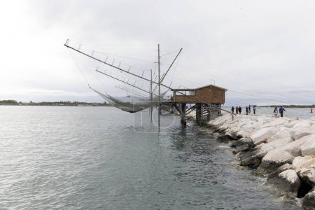 Téléchargez les photos : Sottomarina, Italie - 25 avril 2023 : vue de la maison de pêche à Sottomarina - en image libre de droit