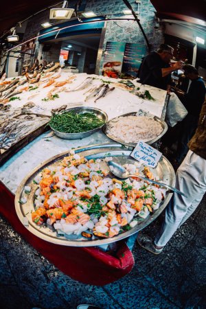 Photo for Palermo, Italy - November 4, 2023: Raw seafood sold on a local market in sicily. Heaps of products lying on counters. - Royalty Free Image