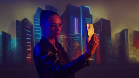 Photo for Portrait of cyberpunk girl. Beautiful young woman on the background of city scyscrapers. Futuristic concept. - Royalty Free Image
