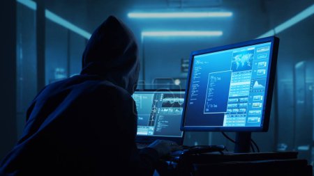 Photo for Computer Hacker in Hoodie. Obscured Dark Face. Hacker Attack, Virus Infected Software, Dark Web and Cyber Security concept. - Royalty Free Image