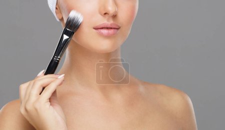 Photo for Beauty portrait of young and attractive woman with makeup brush. Make-up and cosmetics concept. - Royalty Free Image