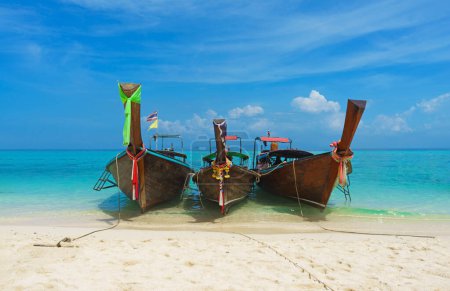 Photo for Thai traditional wooden longtail boat and beautiful sand beach in Thailand. The concept of traveling. - Royalty Free Image