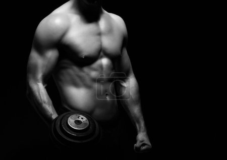 Photo for Strong, fit and sporty bodybuilder man over black background. Sport and fitness concept - Royalty Free Image