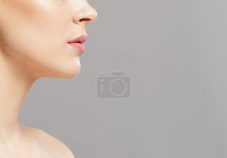 Photo for Close-up portrait of beautiful, fresh, healthy and sensual girl over isolated grey background - Royalty Free Image