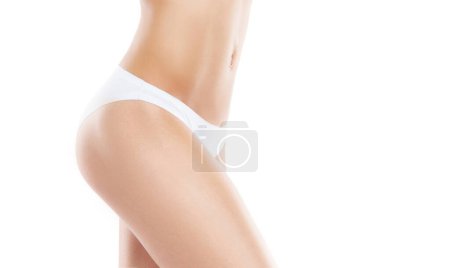 Photo for Young, fit and beautiful woman in white swimsuit over white background. The concept of healthcare, diet, sport and fitness. - Royalty Free Image