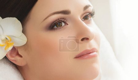 Photo for Young, beautiful and healthy woman in spa salon. Traditional oriental therapy and beauty treatments. - Royalty Free Image