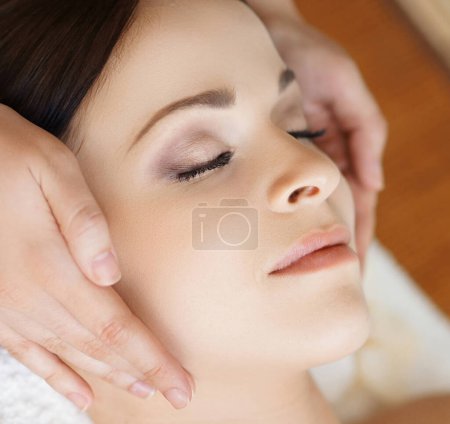 Photo for Young, beautiful and healthy woman in spa salon. Traditional oriental massage therapy and beauty treatments. - Royalty Free Image