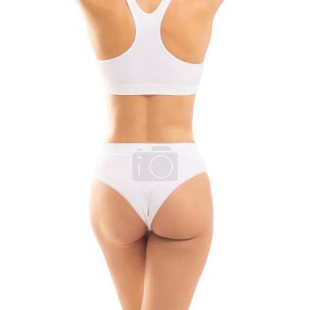 Photo for Young, fit and beautiful woman in white swimsuit over white background. Healthcare, diet, sport and fitness concept. - Royalty Free Image