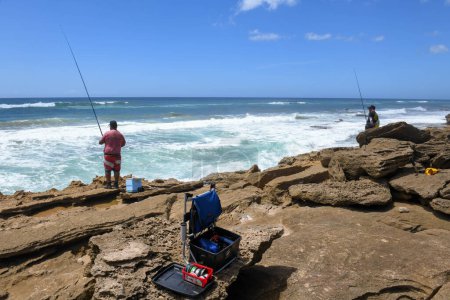 Photo for Mission Rocks, South Africa - 14 January 2023: people fishing at Mission Rocks on Isimangaliso park in South Africa - Royalty Free Image