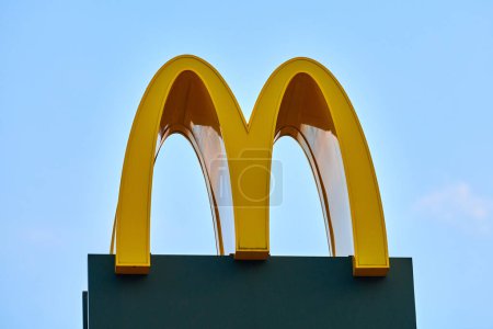 Photo for Rostov on Don, Russia - 02.21.2022 - McDonalds logo roadside sign of fast food restaurant branch, yellow macdonald logo of popular fast food company. Mac donald brand road sign logotype - Royalty Free Image