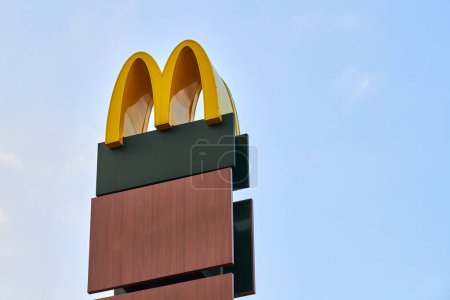 Photo for Rostov on Don, Russia - 02.21.2022 - McDonalds logo roadside sign of fast food restaurant branch, yellow macdonald logo of popular fast food company. Mac donald brand road sign logotype - Royalty Free Image