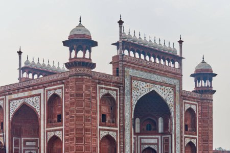 Photo for Taj Mahal entrance gateway close up view with Chhatri dome shaped pavilions Indian architecture blue sky background, aerial view of Taj Mahal main gateway darwaza, monumental Indian architecture - Royalty Free Image