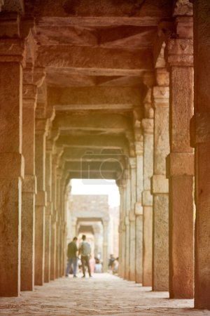 Photo for Stone columns of Qutb complex in South Delhi, India, pillars in ancient ruins of Quwwat ul Islam Mosque landmark, tourists background, popular touristic spot in New Delhi, ancient indian architecture - Royalty Free Image