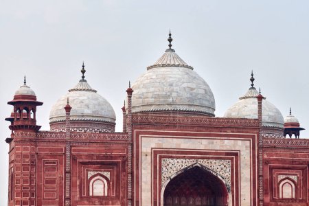 Taj Mahal entrance gateway close up view with Chhatri dome shaped pavilions Indian architecture blue sky background, aerial view of Taj Mahal main gateway darwaza, monumental Indian architecture