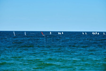 Blue sea sailing regatta, nautical spectacle sport sailing competition among yacht club participants symbolizing spirit of maritime sailing challenge, yacht racing hobby