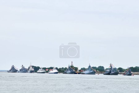 Photo for Military parade of Russian naval forces warships along coastline, seafaring tradition of military ships formation along shore, nautical spectacle of russian sea power - Royalty Free Image