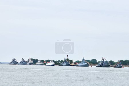 Photo for Military parade of Russian naval forces warships along coastline, seafaring tradition of military ships formation along shore, nautical spectacle of russian sea power - Royalty Free Image