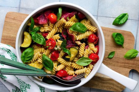 Photo for Pasta with zuccini, tomato and salami and Basil . top weiv.selective focus - Royalty Free Image