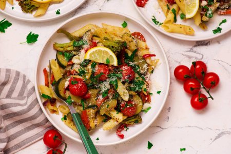 Photo for Pasta Primavera  with zuccini, tomato  and lemon . top weiv.selective focus - Royalty Free Image