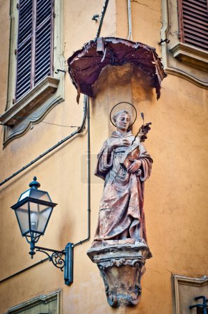 Antique statue of Saint Anthony of Padua in Bologna Italy. 