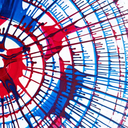 Foto de Una imagen abstracta vívida que muestra una fascinante interacción entre salpicaduras de pintura roja y azul, creando una estructura similar a una red que emana energía y movimiento. - Imagen libre de derechos