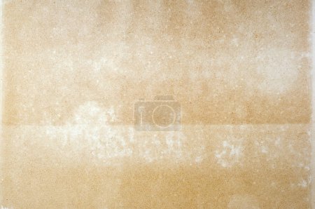 Photo for Close-up of aged, stained paper page from an old book, showcasing a rich texture ideal for a vintage backdrop or historical context. - Royalty Free Image