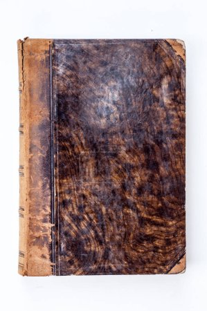 Photo for An antique leather-bound book exudes a sense of history and elegance. The weathered, textured leather cover, marked by time, hints at the untold stories and knowledge preserved within its pages. - Royalty Free Image
