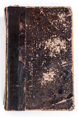 Foto de Primer plano de una cubierta de libro antiguo que muestra un diseño moteado textura única, con una columna vertebral gastada que revela su edad e historia. - Imagen libre de derechos