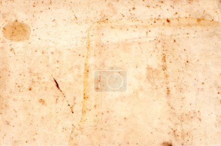 Photo for Close-up of aged, stained paper page from an old book, showcasing a rich texture ideal for a vintage backdrop or historical context. - Royalty Free Image