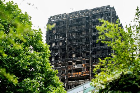 Photo for London, UK. 28th June 2017. EDITORIAL - The Grenfell Tower Fire - The burnt remains and devastation of the fierce fire, which ripped through the tower block leaving hundreds homeless and many dead. - Royalty Free Image