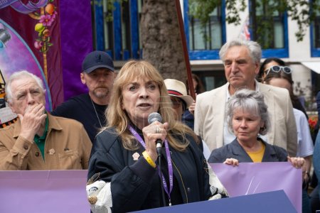 Photo for London, UK. 21st July 2023. President of Equity Lynda Rooke speaking at the Equity Union rally, London, standing in solidarity with SAG-AFTRA actors strike in America, for fair pay, residual payments and issues on A.I. - Royalty Free Image