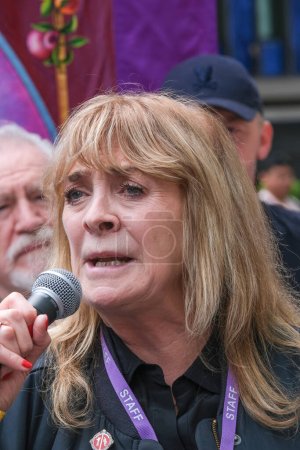 Photo for London, UK. 21st July 2023. Lynda Rooke speaking at the Equity Union rally, London, standing in solidarity with SAG-AFTRA actors strike in America, for fair pay, residual payments and issues on A.I. - Royalty Free Image