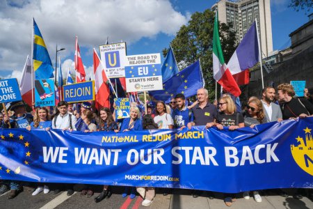 Photo for London, UK. 23rd September 2023. Pro-EU supporters holding the lead banner sign at the anti-Brexit National Rejoin March rally in London, calling for the United Kingdom to rejoin the European Union. - Royalty Free Image