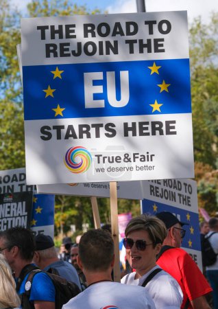 Photo for London, UK. 23rd September 2023. Pro-EU supporters holding protest signs at the anti-Brexit National Rejoin March rally in London, calling for the United Kingdom to rejoin the European Union. - Royalty Free Image
