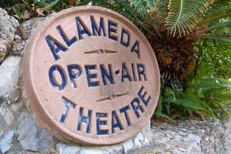 Large oval shaped sign at the entrance to the Alameda Open Air Theatre at Gibraltar.
