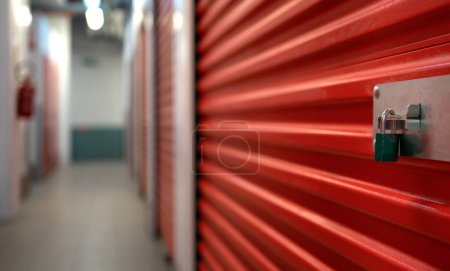 Photo for Red metallic storage box detail with padlock. Close up with copy space. Safety concept. - Royalty Free Image