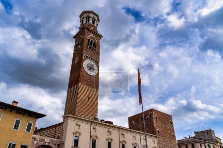 Photo for Torre dei Lamberti, medieval tower (XI century-1403) in Piazza delle Erbe, UNESCO heritage site. Verona, Italy. - Royalty Free Image