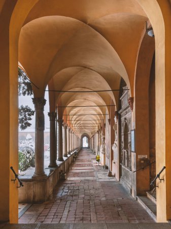 Photo for BOLOGNA, ITALY - FEBRAUARY 2013: The Certosa di Bologna portico view under the snow, a former Carthusian monastery, become in 1801 the citys Monumental Cemetery. - Royalty Free Image