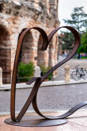 Photo for VERONA, ITALY - OCTOBER, 2020: "Forever Love"bench sculpture by Atelier Studio Borella in Bra square close to the Arena. - Royalty Free Image