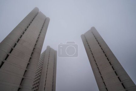 Photo for BOLOGNA, ITALY - DECEMBER 2019: Fiera District buildings in a foggy day by Kenzo Tange. The Exhibition Centre located in this building has over 375,000 m2 of total surface area. - Royalty Free Image