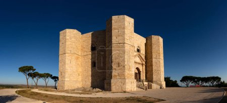 Photo for Panoramic view of Castel del Monte, the famous castle built in an octagonal shape by the Holy Roman Emperor Frederick II in the 13th century in Apulia, Italy. World Heritage Site since 1996. - Royalty Free Image