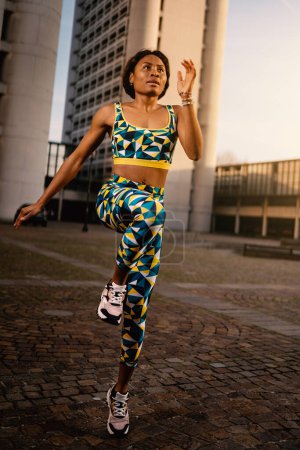 Photo for Young black african sporty woman portrait running outdoors. Active lifestyle. - Royalty Free Image